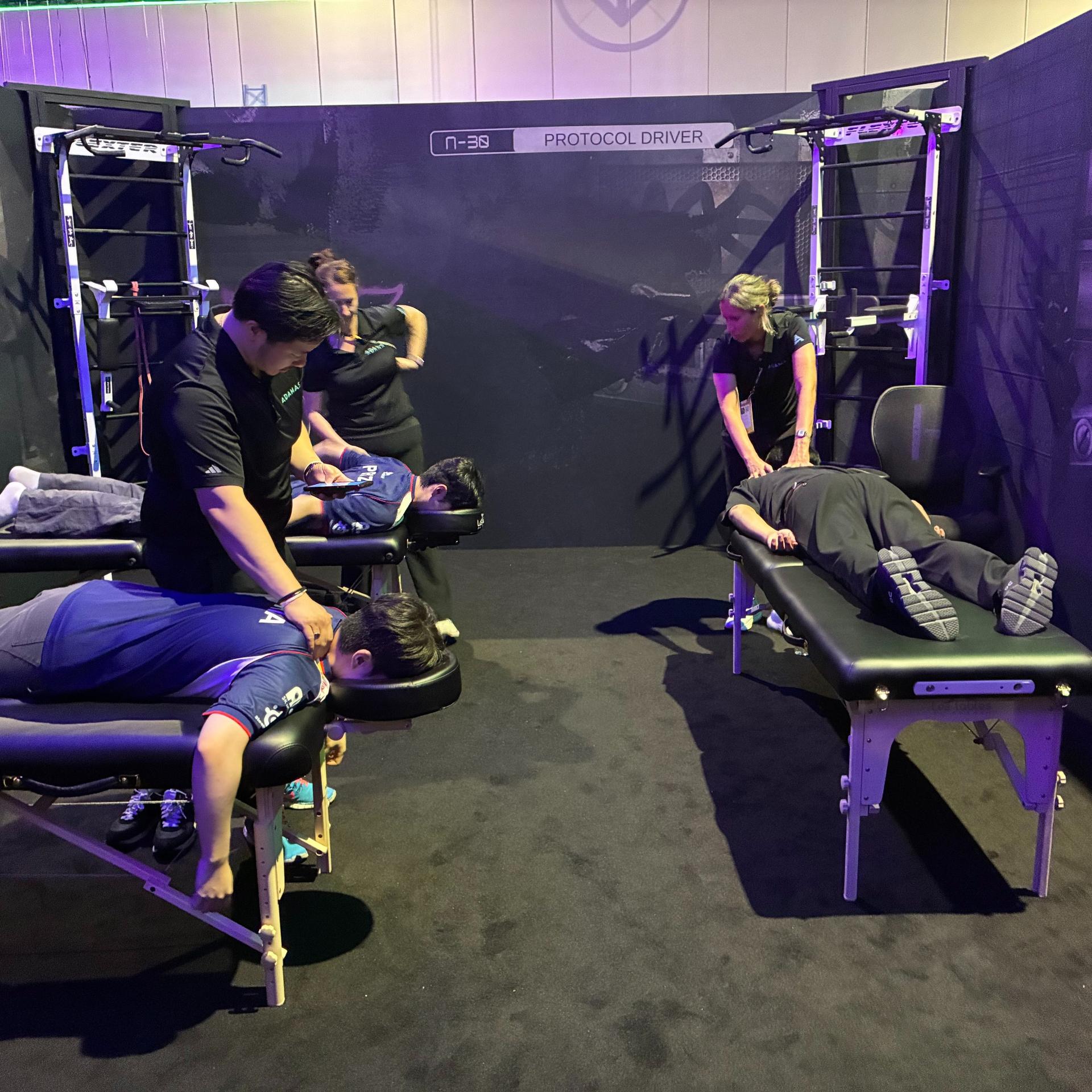 Adamas practitioner working with a player on site